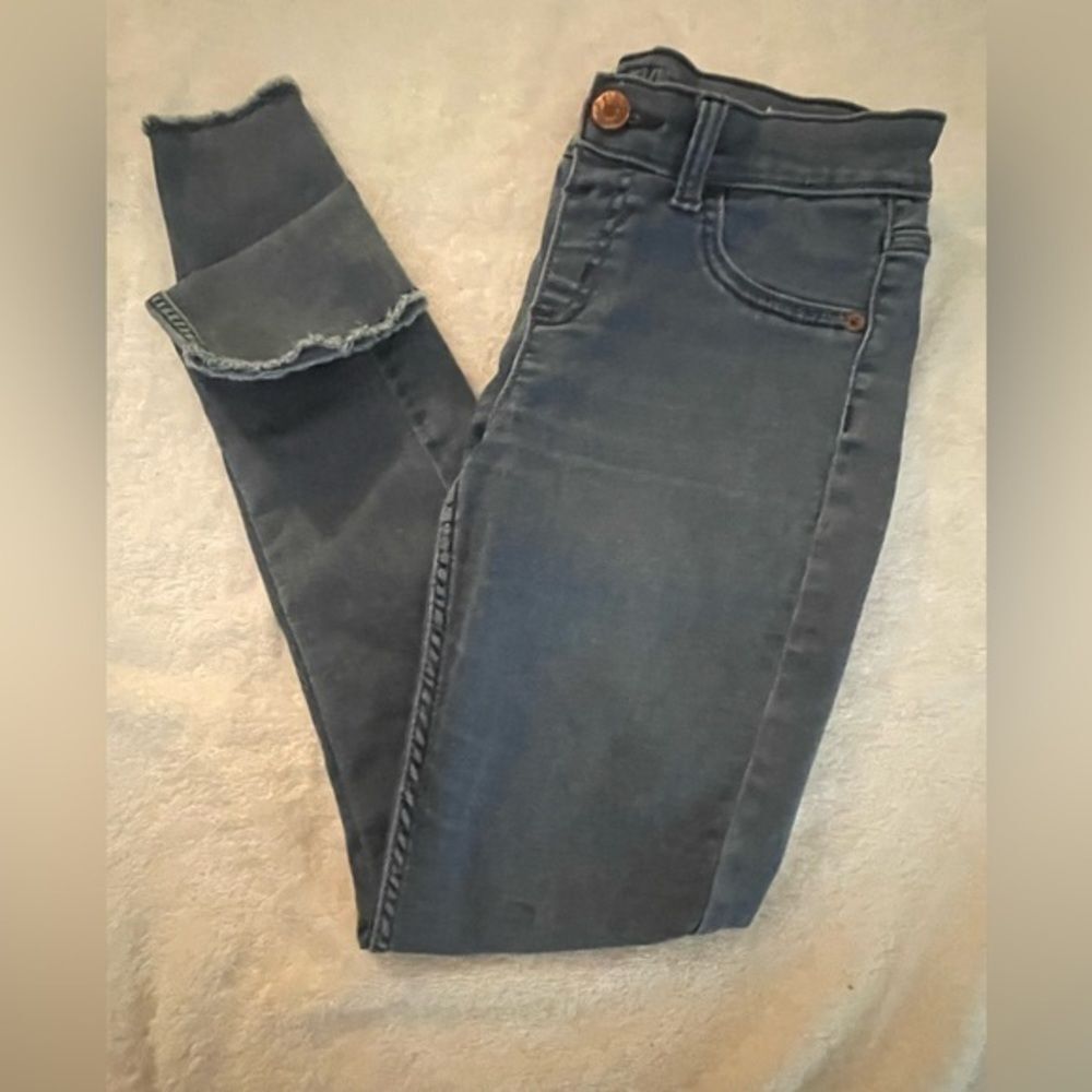 Girl’s size 14 Justice dark wash trashed/(distressed) cuff skinny jeans